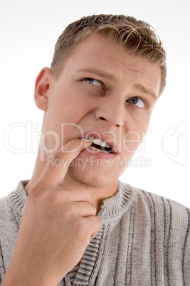 thinking man putting his finger in mouth