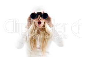 front view of amazed woman looking through binoculars