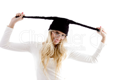 front view of smiling woman in woolen cap