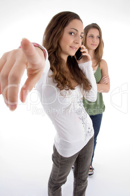 teenager beautiful young girls posing with hand gesture