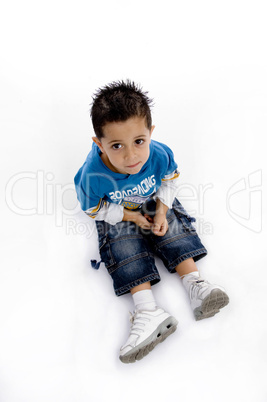 smart boy sitting on ground