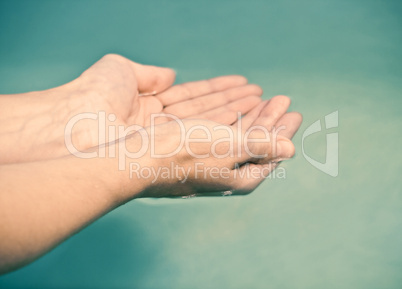 hands in water