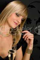 Glamorous blond woman party dress closed eyes