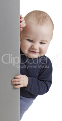 young child holding vertical sign