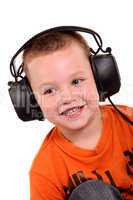 Little boy in headphones on the white background