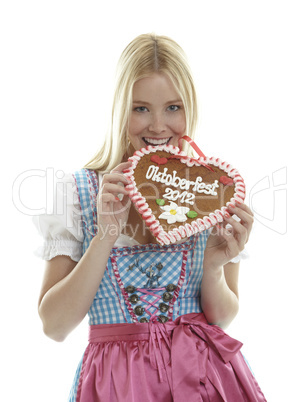 Woman bites in a German Gingerbread heart