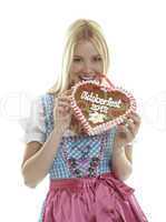 Woman bites in a German Gingerbread heart