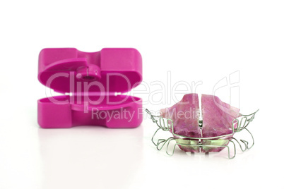 braces with a pink box