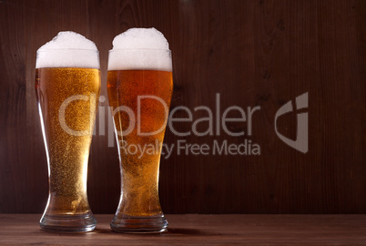 beer in glass on wooden