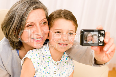 Grandmother and young girl take picture themselves