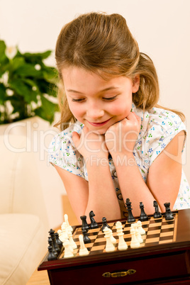 Young girl play chess cute smile