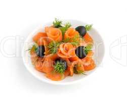Appetizer of salmon with fennel and olives on a white background