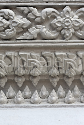 White stucco , thai style on the Wall