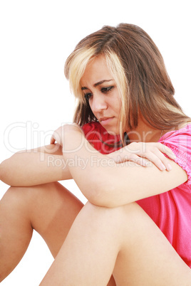Depressed teenage girl. Isolated on white.