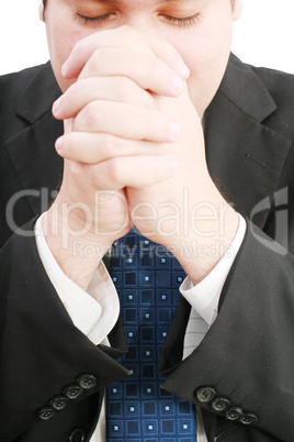portrait of businessman praying for success