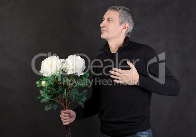 Man holding a bouquet of flowers