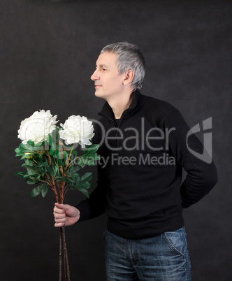 Man holding a bouquet of flowers