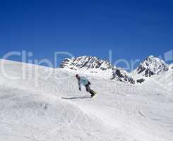 Snowboarding in high mountains