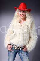Curly blonde in a red hat and white fluffy fur coat