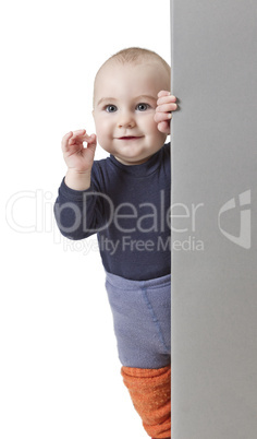 young child holding vertical sign