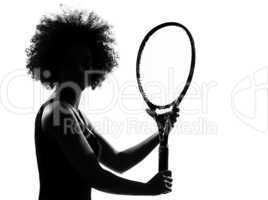 young afro american woman silhouette playing tennis