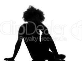 young afro american woman silhouette sit on the floor sadness