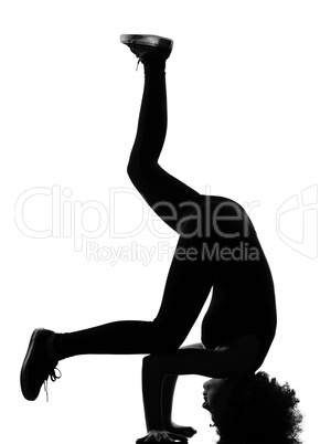 young afro american woman silhouette breakdance headstand