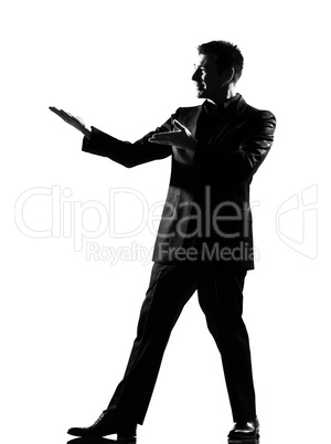 silhouette  man  showing gesture introducing presentation