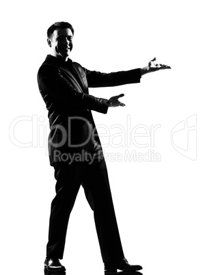 silhouette  man  showing gesture introducing presentation