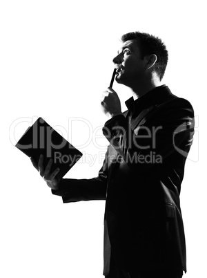 silhouette  man with note pad pensive thinking