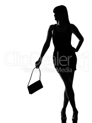 stylish silhouette woman waiting holding purse