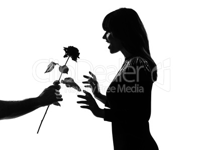 silhouette man hand offering a flower rose
