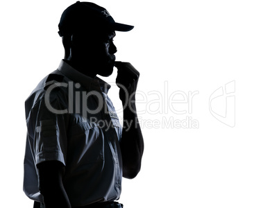 Policeman blowing whistle