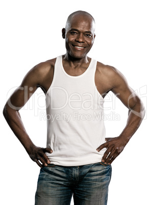 Portrait of handsome smiling african man with hands on waist