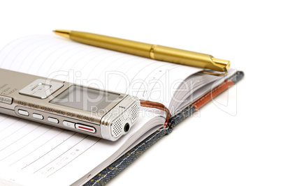 Dictaphone, notepad and ballpen