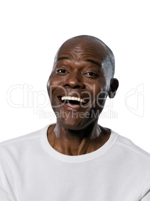 Close-up of man laughing in studio