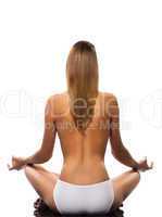 Topless woman meditating