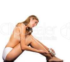 Topless beautiful woman sitting on floor full lengt with body lo