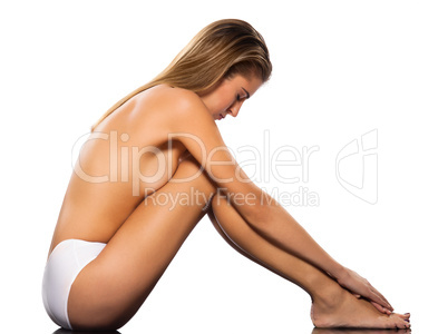 Topless attractive woman meditating