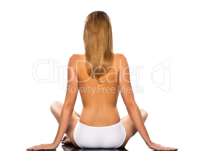 rear view back woman Topless sitting with long blond hair