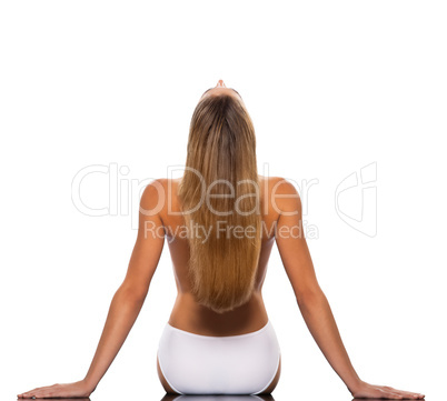 Blond haired woman stretching backwards