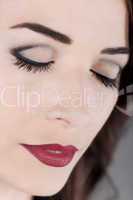 Beautiful woman eyes closed and red lips close up