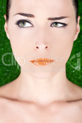 Beautiful angry woman with glossy lips looking away