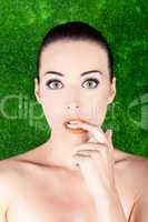 Beautiful nervous woman biting her finger