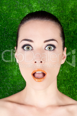 Portrait of a surprised beautiful woman mouth open