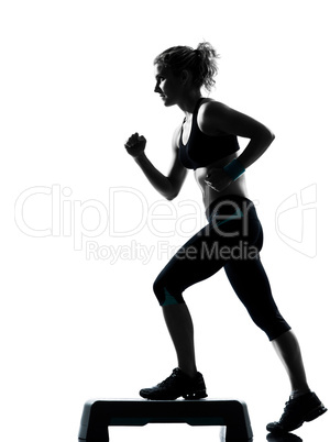 woman exercising step aerobics.