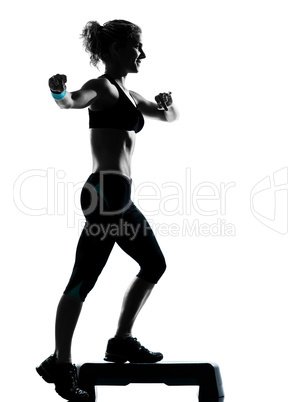 woman exercising step aerobics.