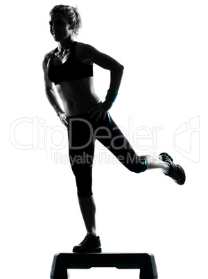 woman exercising step aerobics.