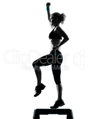 woman exercising step aerobics.