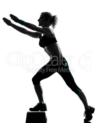 woman exercising step aerobics.